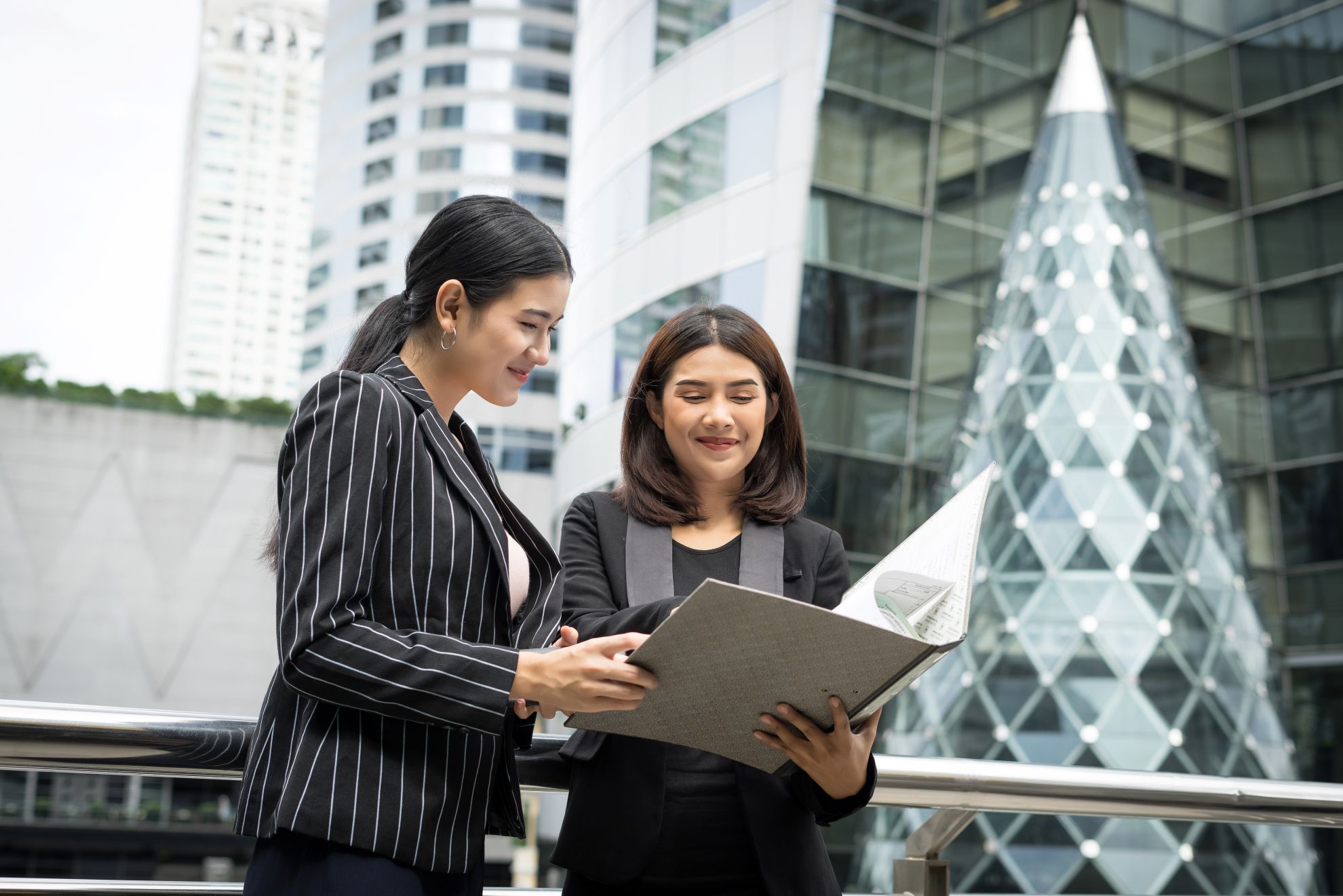 Two professionals reviewing documents together